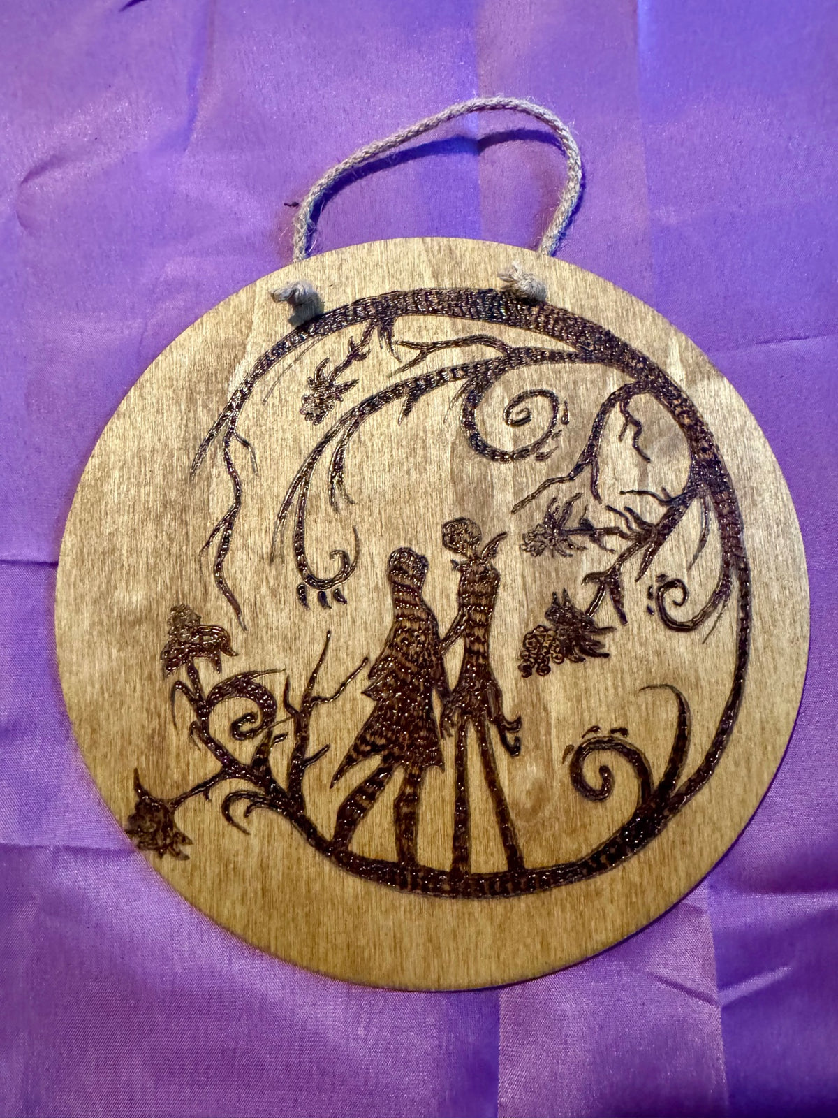 Holding Hands Under the Branches woodburning plaque