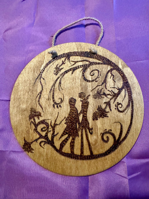 Holding Hands Under the Branches woodburning plaque
